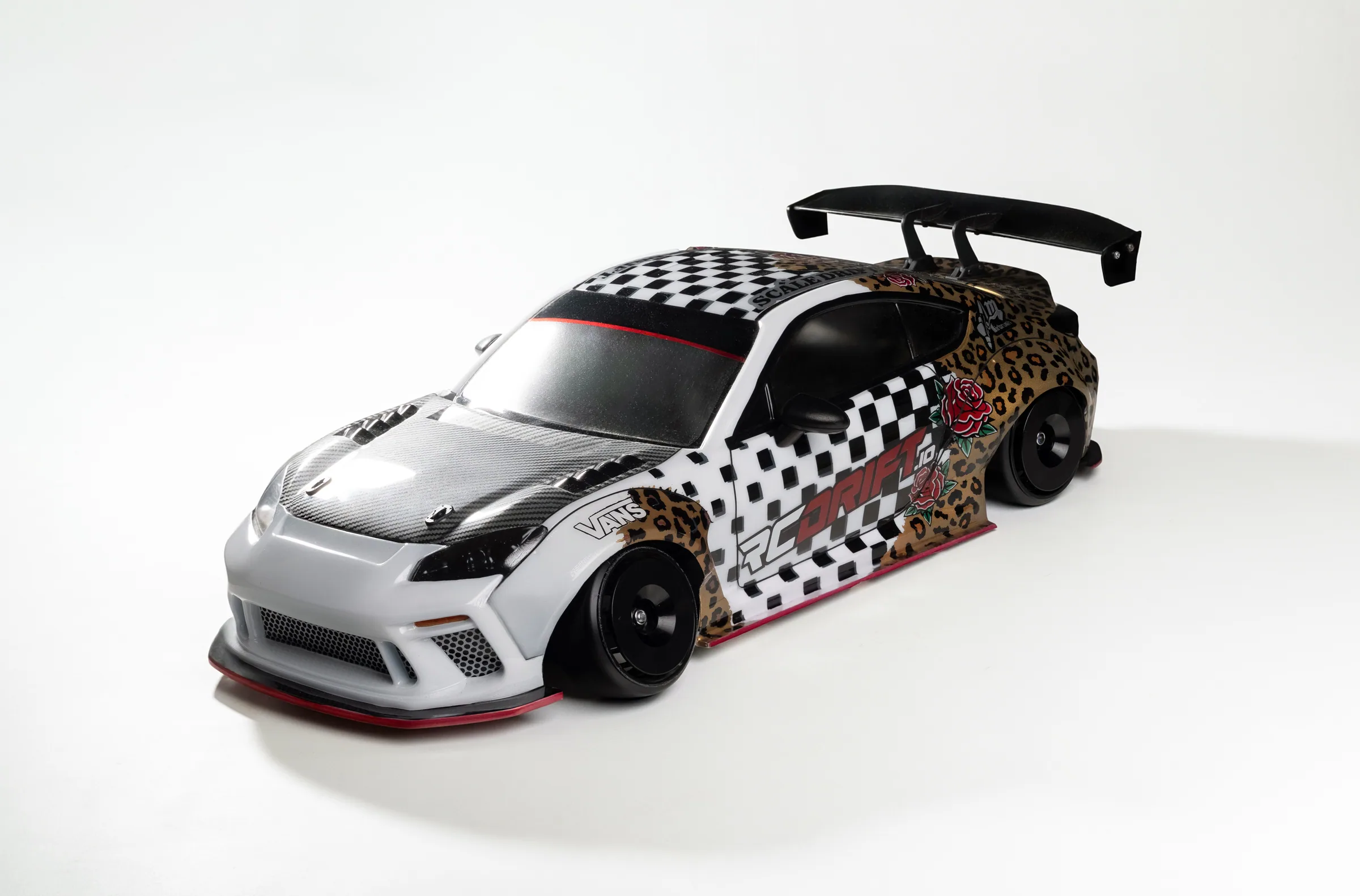 The V0 with a body shell fitted, on the studio backdrop